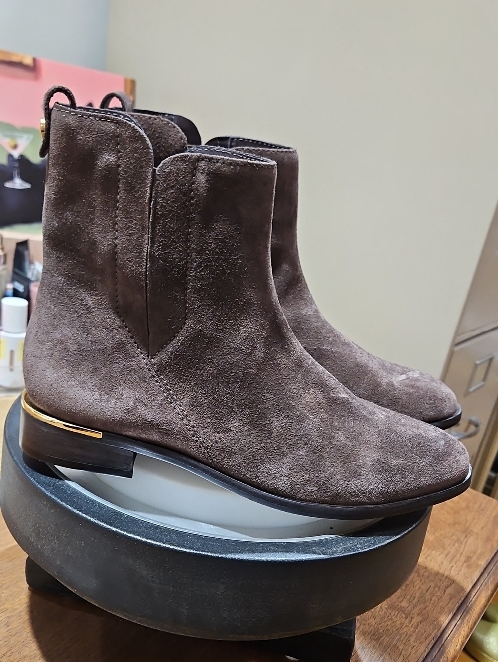 Brown suede Vince Camuto Okalinra ankle boots w/ a sleek metallic gold Trim
